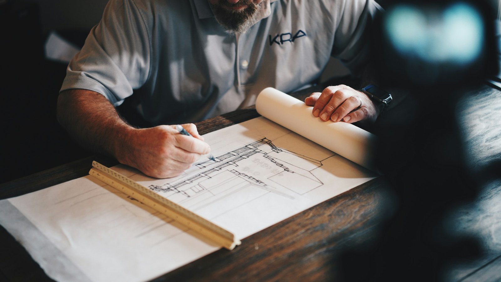 Engineer reviewing technical drawings