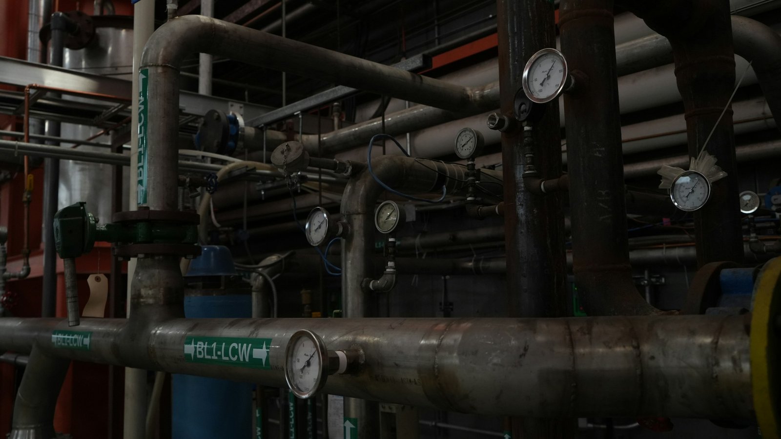 Mechanical plant room with insulated pipework and pressure gauges